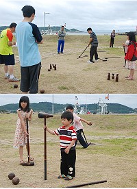 101年度連江縣「打造運動樂活島─親子木球育樂營」昨天在福澳海巡前公園登場,歡樂中訓練技術也培養親情。(圖/文:邱竟瑋)