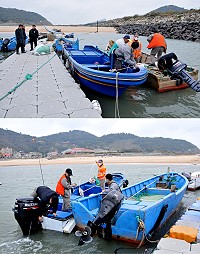 　交通部航港局北部航務中心派員在地區各澳口檢丈19噸級以下小船，7月1日起正式接管小船監理業務。（圖／文：陳鵬雄）