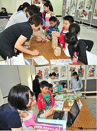 臺北市立圖書館離島偏鄉圖書資源推廣列車16日下午開抵馬祖,圖書資源索引、認識電子書是以筆電讓民眾自行體驗,館員在旁提供說明,疊疊樂則是成功擄獲小朋友的心,許多學生玩得欲罷不能。(圖/文:曹重偉)