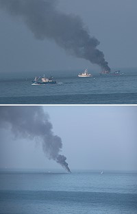 仁愛澳口外海昨天發現失火大陸漁船,船上5名遇險船員已被附近發現的友船救走,人員平安。(圖:王建華、吳嘉榮)