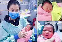 產婦游斐琇滿足開心抱著兒子。(圖:李婕葳)