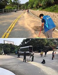 南竿昨日一日發生2起漏油,警方、環資局同仁疲於奔命,在太陽下整理路面、指揮交通。(圖/文:馮紹夫)