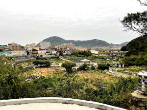 　塘岐怡園公園佔地面積廣大，地形較閃風，在示範住宅選址中受到青睞。（圖／文：陳鵬雄）